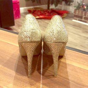 Audrey Brooke  gold heels